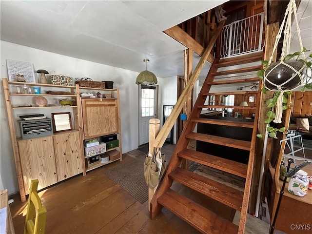 staircase with hardwood / wood-style flooring