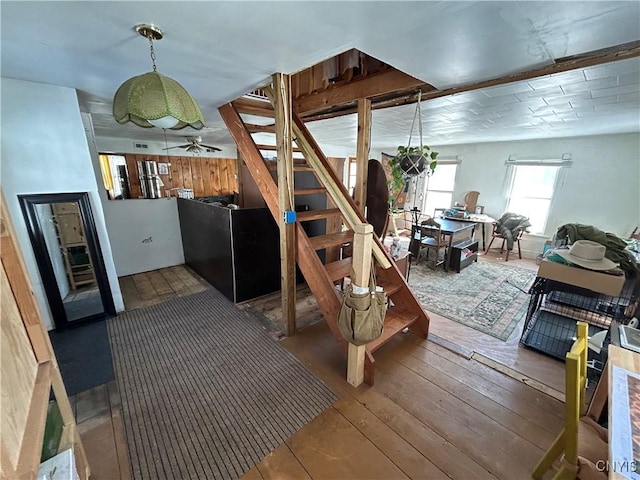 basement with stairway and wood-type flooring