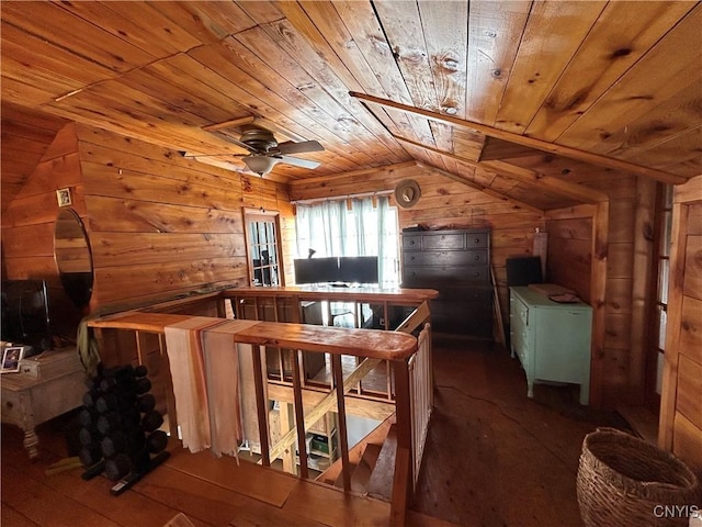 interior space featuring wooden ceiling, wood walls, and vaulted ceiling