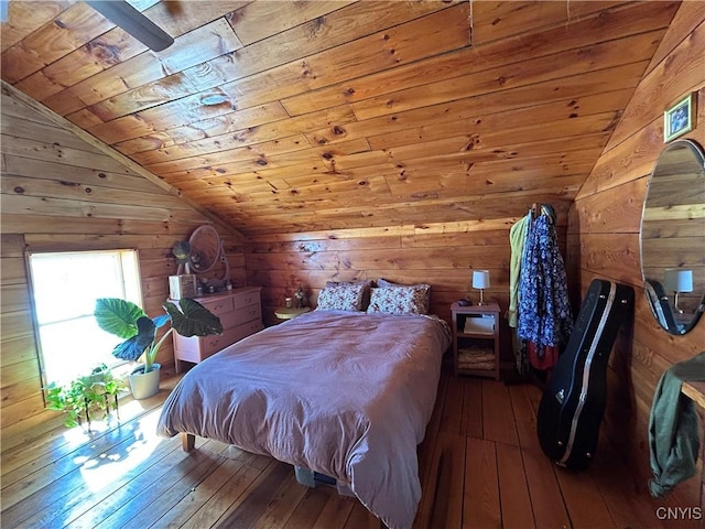 bedroom featuring hardwood / wood-style floors, lofted ceiling, wood ceiling, and wood walls