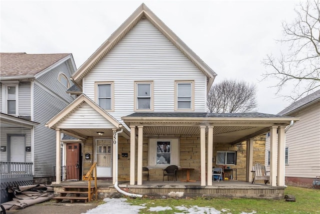 view of front facade with a porch and stone siding