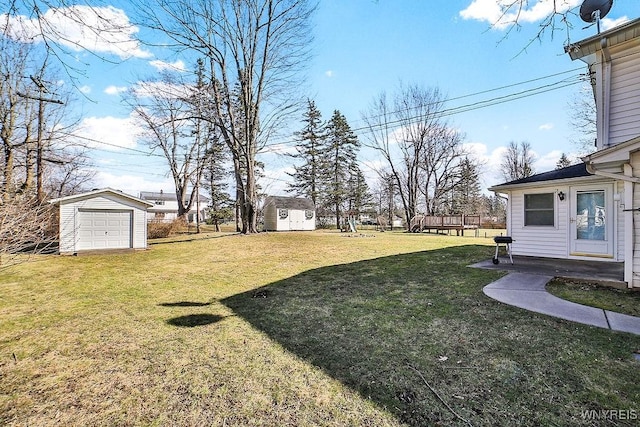 view of yard featuring an outbuilding and a storage unit