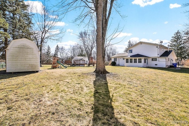 view of yard with an outbuilding and a playground