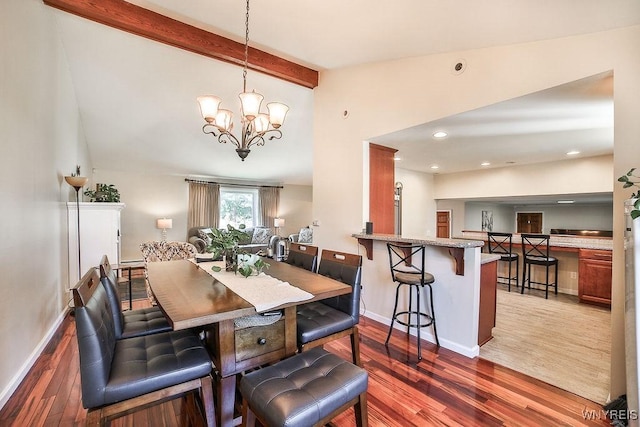 dining room with a chandelier, vaulted ceiling with beams, baseboards, and dark wood-style flooring