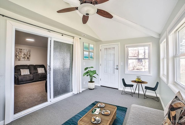 sunroom / solarium featuring a ceiling fan and vaulted ceiling