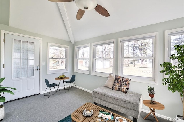 sunroom / solarium featuring vaulted ceiling with beams and a ceiling fan