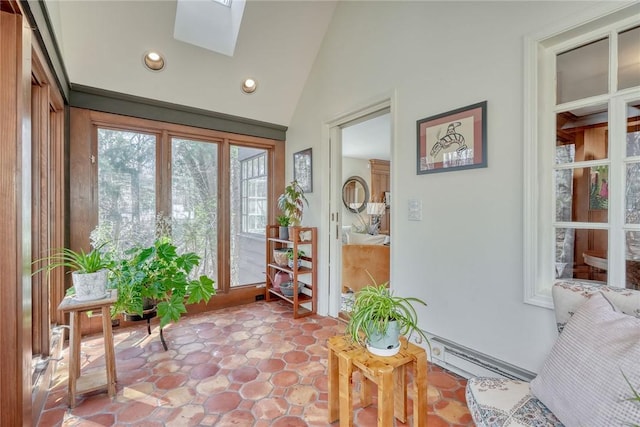 doorway featuring recessed lighting, a baseboard radiator, and lofted ceiling with skylight