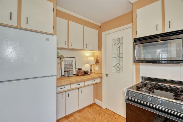 kitchen with black appliances, backsplash, white cabinetry, crown molding, and light countertops