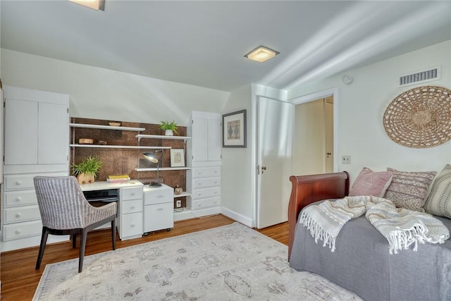 interior space featuring visible vents and wood finished floors