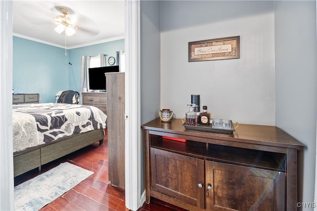 bedroom with dark wood-style floors, a dry bar, and ornamental molding