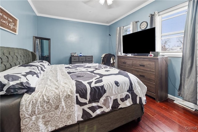 bedroom featuring visible vents, crown molding, baseboards, dark wood-type flooring, and a ceiling fan