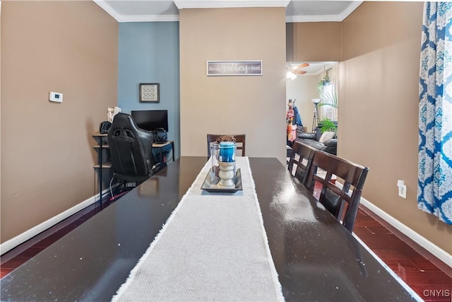 dining area with wood finished floors, baseboards, and ornamental molding