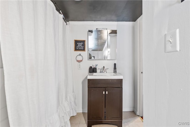 bathroom with a shower with shower curtain, vanity, and tile patterned flooring