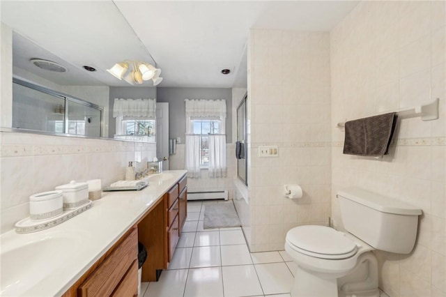 bathroom featuring shower / bath combination with glass door, a baseboard radiator, tile walls, toilet, and tile patterned floors