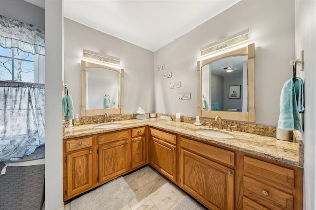 bathroom with double vanity and a sink