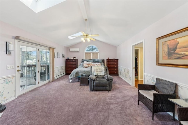 carpeted bedroom featuring a wainscoted wall, lofted ceiling with skylight, a wall mounted AC, and access to outside