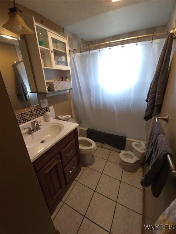 full bathroom featuring vanity, decorative backsplash, shower / tub combo, tile patterned floors, and toilet