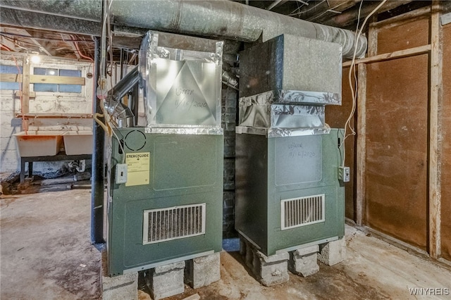 utility room featuring heating unit