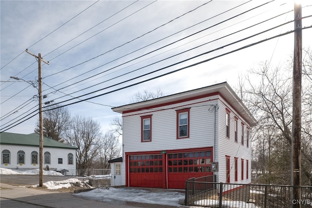 view of side of property with a garage