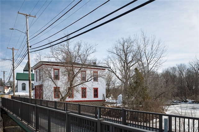 view of home's exterior featuring fence