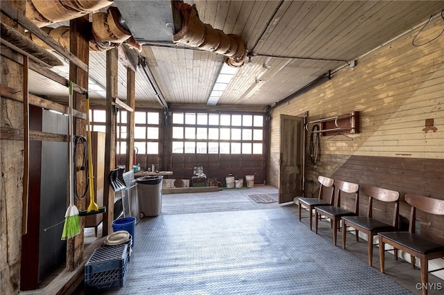 miscellaneous room featuring wooden ceiling and a garage