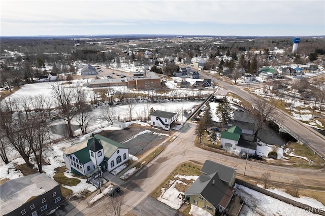 snowy aerial view featuring a residential view