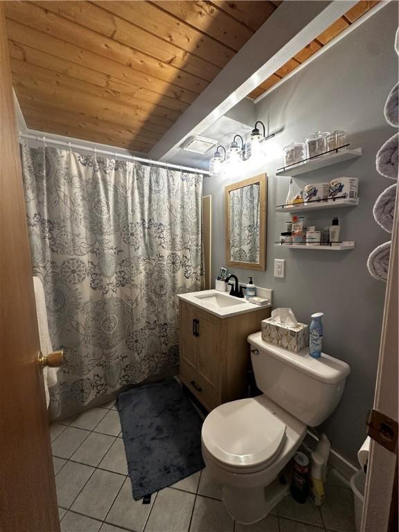 full bathroom with toilet, curtained shower, tile patterned flooring, wood ceiling, and vanity