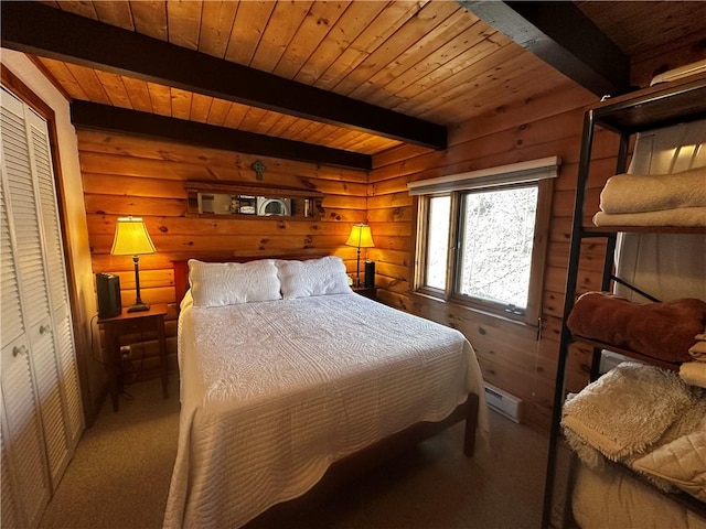 bedroom with beam ceiling, wooden ceiling, and carpet flooring