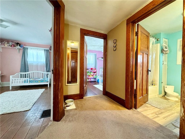 464 Pine St, Erwin, NY 14870 - hall with wood finished floors, baseboards, and visible vents