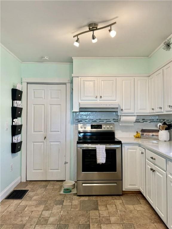 464 Pine St, Erwin, NY 14870 - kitchen featuring decorative backsplash, light countertops, stainless steel range with electric stovetop, under cabinet range hood, and crown molding