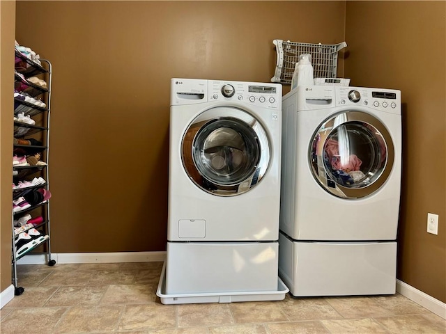 464 Pine St, Erwin, NY 14870 - laundry area featuring stone finish floor, laundry area, washing machine and dryer, and baseboards