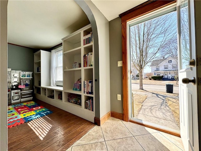 464 Pine St, Erwin, NY 14870 - game room with arched walkways, baseboards, and wood finished floors