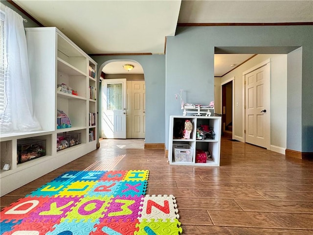 464 Pine St, Erwin, NY 14870 - playroom featuring arched walkways, plenty of natural light, baseboards, and wood finished floors