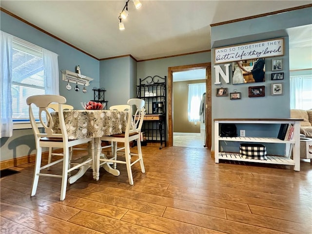 464 Pine St, Erwin, NY 14870 - dining room with ornamental molding, wood finished floors, and a healthy amount of sunlight