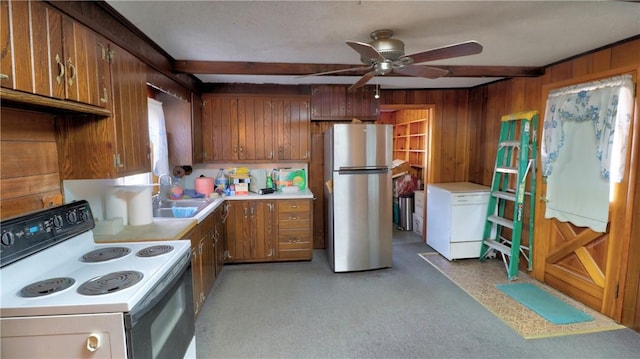 kitchen featuring beamed ceiling, brown cabinets, a sink, white electric range oven, and freestanding refrigerator