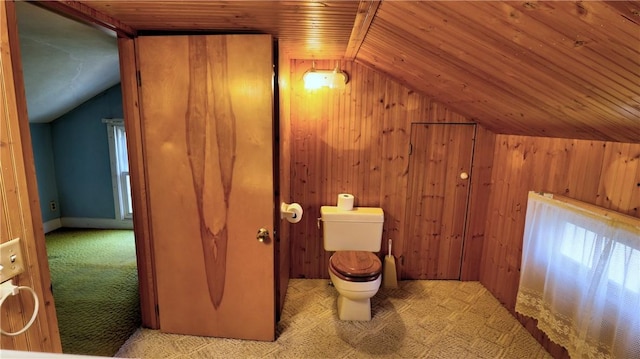 bathroom featuring lofted ceiling, toilet, wood ceiling, and wooden walls