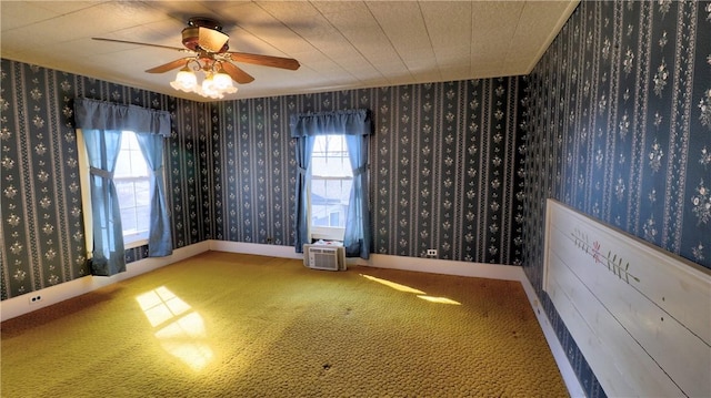 carpeted spare room with ceiling fan, wallpapered walls, and baseboards