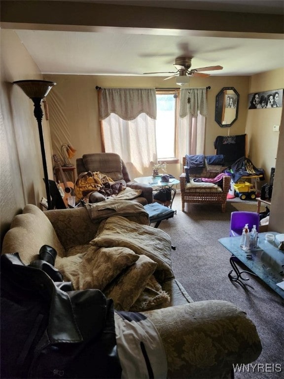 living room featuring carpet flooring and a ceiling fan