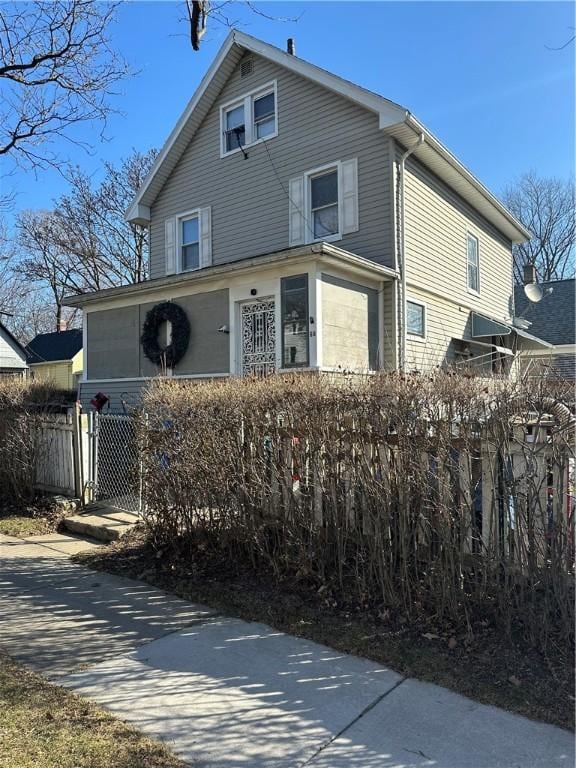 view of side of property featuring fence