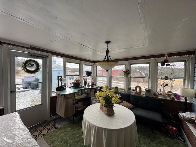 sunroom / solarium featuring plenty of natural light