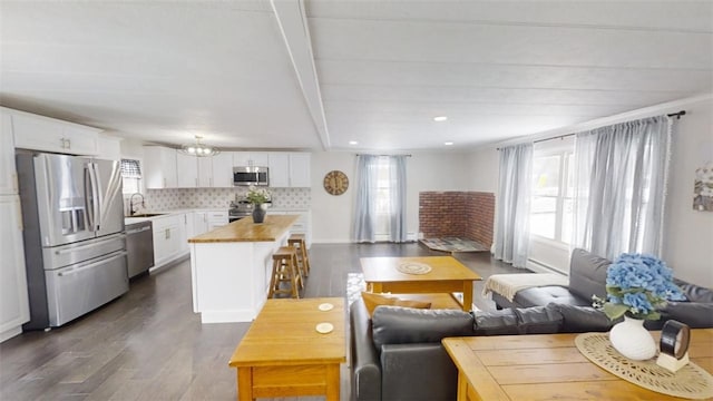 6339 County Road 32, North Norwich, NY 13815 - living area with a wealth of natural light, recessed lighting, and dark wood-style floors