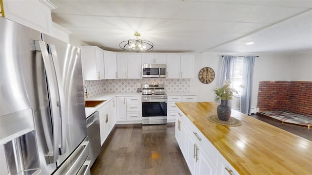 6339 County Road 32, North Norwich, NY 13815 - kitchen featuring tasteful backsplash, dark wood-style floors, butcher block counters, white cabinets, and stainless steel appliances