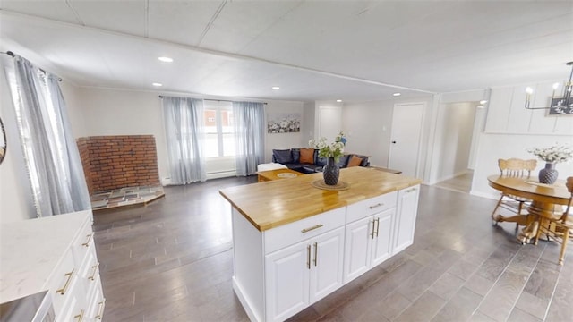 6339 County Road 32, North Norwich, NY 13815 - kitchen with a center island, white cabinets, recessed lighting, and wood counters