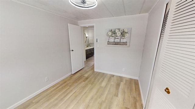 6339 County Road 32, North Norwich, NY 13815 - unfurnished bedroom featuring light wood finished floors, baseboards, and crown molding