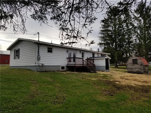 6339 County Road 32, North Norwich, NY 13815 - back of property with a yard, a wooden deck, a storage shed, and an outbuilding