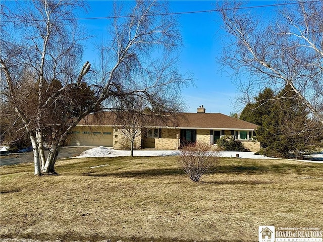 single story home featuring a front yard, an attached garage, and a chimney