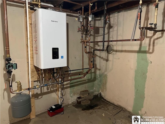 utility room featuring water heater