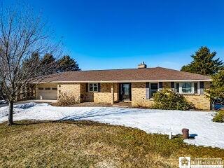 single story home with an attached garage