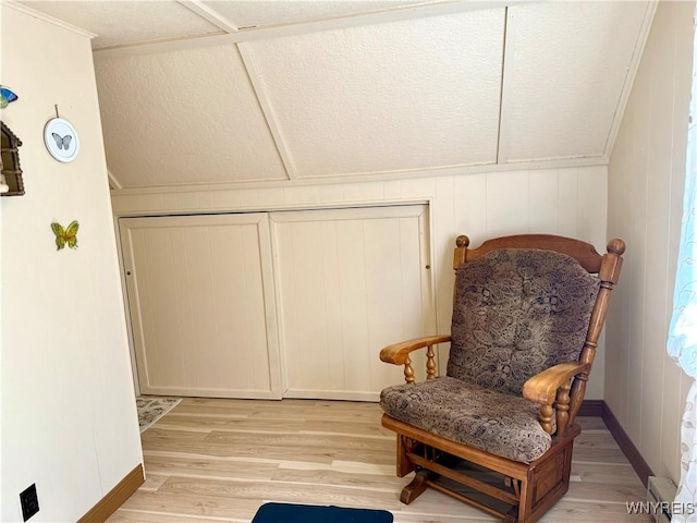 sitting room with light wood-style flooring