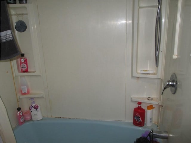 bathroom with a tub and a shower